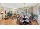 Cozy living room featuring plantation shutters and a decorative rug under the dining table at 20462 N Ridgewood Ln, Surprise, AZ 85374