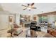 Bright and open living space with comfortable seating and adjacent kitchen and dining area at 20462 N Ridgewood Ln, Surprise, AZ 85374