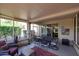 Covered patio featuring outdoor furniture with access to the home's interior at 20462 N Ridgewood Ln, Surprise, AZ 85374