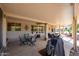 Large covered patio with seating, dining, and a barbecue area for outdoor enjoyment at 20462 N Ridgewood Ln, Surprise, AZ 85374