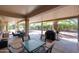 A large, covered outdoor living space perfect for entertaining with backyard views at 20462 N Ridgewood Ln, Surprise, AZ 85374