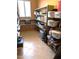 Spacious storage room featuring built-in shelving and tiled flooring for organization at 20462 N Ridgewood Ln, Surprise, AZ 85374
