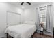 Bright bedroom features a ceiling fan, window, and closet for comfort and convenience at 2067 N Marketside Ave, Buckeye, AZ 85396