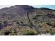 Challenging hiking trail with stairs ascending a steep mountain, set in a sunny, natural landscape at 2067 N Marketside Ave, Buckeye, AZ 85396