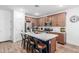 Kitchen featuring a large island with seating and stainless steel appliances at 2067 N Marketside Ave, Buckeye, AZ 85396