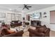 Cozy living room with comfortable seating, neutral tones, and a modern fireplace at 2067 N Marketside Ave, Buckeye, AZ 85396
