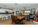 The dining area features an island in the kitchen with views of the backyard and a Gathering room at 22853 E Estrella Rd, Queen Creek, AZ 85142