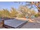 Charming backyard featuring a wooden deck and casual seating areas at 2409 N 57Th St, Scottsdale, AZ 85257