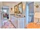 Stylish bathroom highlighting double sinks, elegant mirrors, and a luxurious walk-in shower with a soaking tub at 2409 N 57Th St, Scottsdale, AZ 85257