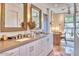 Bright bathroom featuring a double vanity, modern fixtures, decorative mirrors, and ample counter space at 2409 N 57Th St, Scottsdale, AZ 85257
