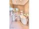 Relaxing bathroom with a freestanding tub, walk-in shower, and soothing neutral tones for a calming experience at 2409 N 57Th St, Scottsdale, AZ 85257