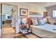 Inviting bedroom showcasing a comfortable bed, stylish bedside table, and a glimpse into the living area at 2409 N 57Th St, Scottsdale, AZ 85257