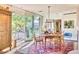 Charming dining room with a rustic table, area rug, and lots of natural light at 2409 N 57Th St, Scottsdale, AZ 85257