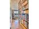 Hallway with a bookshelf leading to a bedroom and a bathroom at 2409 N 57Th St, Scottsdale, AZ 85257