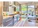 Sleek kitchen boasts modern appliances, plenty of counter space, and backyard views at 2409 N 57Th St, Scottsdale, AZ 85257