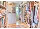 Bright, organized walk-in closet with custom shelving, clothing racks, and a colorful rug at 2409 N 57Th St, Scottsdale, AZ 85257