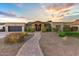 Charming single-story home featuring a desert landscape and a quaint brick walkway at 2410 E Cholla St, Phoenix, AZ 85028