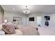 Comfortable main bedroom featuring chandelier lighting and television at 2410 E Cholla St, Phoenix, AZ 85028