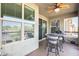 Balcony featuring an outdoor ceiling fan, table, chairs, and views of the neighborhood at 2425 W Bronco Butte Trl # 2008, Phoenix, AZ 85085