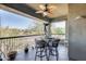 Cozy balcony features an outdoor ceiling fan, table, and chairs with views of the neighborhood at 2425 W Bronco Butte Trl # 2008, Phoenix, AZ 85085