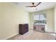 Bedroom featuring neutral carpet, modern light fixture, file cabinet, and window with neighborhood views at 2425 W Bronco Butte Trl # 2008, Phoenix, AZ 85085
