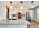 Bright kitchen with granite countertops, stainless steel appliances, and pendant lighting at 2425 W Bronco Butte Trl # 2008, Phoenix, AZ 85085