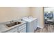 Bright laundry room features a sink and plenty of space with a washing machine and dryer at 2425 W Bronco Butte Trl # 2008, Phoenix, AZ 85085