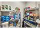 Spacious storage room featuring metal shelves stocked with household supplies, cleaning products, and towels at 2425 W Bronco Butte Trl # 2008, Phoenix, AZ 85085
