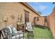 Charming backyard with cozy seating and a swing, creating a relaxed and inviting outdoor space at 26065 W Yukon Dr, Buckeye, AZ 85396