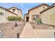 Inviting single-story home with manicured desert landscaping and a welcoming walkway at 26065 W Yukon Dr, Buckeye, AZ 85396