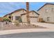 Charming single-story home with a two-car garage, desert landscaping, and a spacious driveway at 26065 W Yukon Dr, Buckeye, AZ 85396
