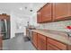 The kitchen features wood cabinets, stainless steel dishwasher, and neutral countertops at 26065 W Yukon Dr, Buckeye, AZ 85396