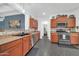 A modern kitchen is showcased with wood cabinets, stainless steel appliances, and stylish countertops at 26065 W Yukon Dr, Buckeye, AZ 85396