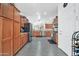 Spacious kitchen with wood cabinets, stainless steel appliances, and modern tile floors at 26065 W Yukon Dr, Buckeye, AZ 85396