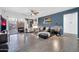 Open-concept living room featuring modern decor, comfortable seating, and a sliding glass door at 26065 W Yukon Dr, Buckeye, AZ 85396