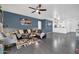 Bright and airy living room with modern decor, tile floors, and ample seating at 26065 W Yukon Dr, Buckeye, AZ 85396