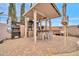 Outdoor kitchen and dining area features a built-in bar, and plenty of room for entertaining guests at 26065 W Yukon Dr, Buckeye, AZ 85396
