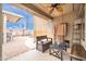 Inviting covered patio featuring comfortable seating and views of the refreshing swimming pool, creating a relaxed atmosphere at 26065 W Yukon Dr, Buckeye, AZ 85396