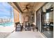 Covered patio offers a cozy seating area with views of the backyard and a charming atmosphere for relaxation at 26065 W Yukon Dr, Buckeye, AZ 85396