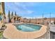 Beautiful pool with a tanning deck surrounded by desert landscaping and a covered bar at 26065 W Yukon Dr, Buckeye, AZ 85396