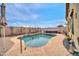 Private pool with desert plants and a hot tub, perfect for relaxation and entertainment at 26065 W Yukon Dr, Buckeye, AZ 85396