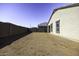 Spacious backyard featuring block wall fencing offering privacy with ample space for landscaping and outdoor activities at 38197 W San Clemente St, Maricopa, AZ 85138