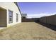 View of the backyard with block fence at 38197 W San Clemente St, Maricopa, AZ 85138