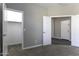 Spacious bedroom featuring plush carpeting and ample closet space, perfect for a comfortable retreat at 38197 W San Clemente St, Maricopa, AZ 85138