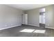 The bedroom is bright and spacious with an open doorway to the bathroom at 38197 W San Clemente St, Maricopa, AZ 85138