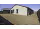 Exterior view of the back of the house with block fence at 38197 W San Clemente St, Maricopa, AZ 85138