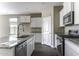 Well-appointed kitchen featuring modern appliances, a spacious island, and ample cabinet storage at 38197 W San Clemente St, Maricopa, AZ 85138