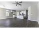 Open-concept living space showcasing modern finishes and seamless flow into the adjacent kitchen at 38197 W San Clemente St, Maricopa, AZ 85138