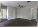 Open living area boasting stylish flooring, neutral walls, and access to other rooms at 38197 W San Clemente St, Maricopa, AZ 85138