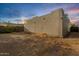View of the back exterior wall and backyard at 407 E Eason Ave, Buckeye, AZ 85326